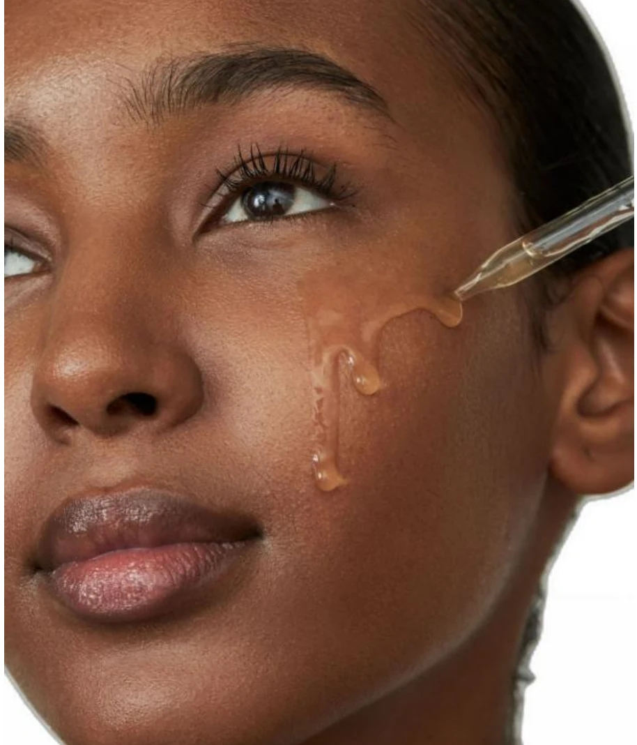 Applying facial serum as part of a daily moisturizing skincare routine
