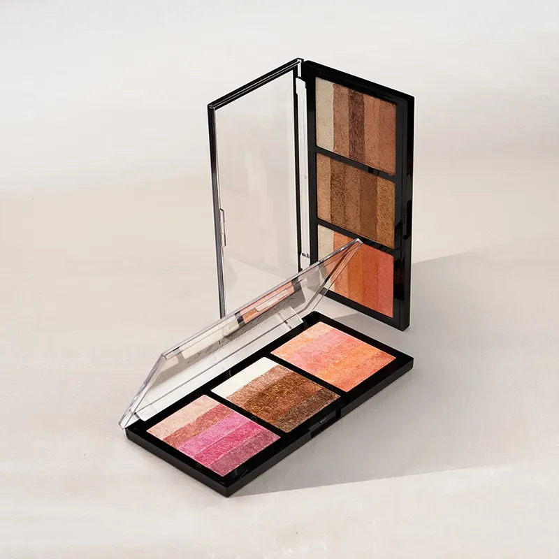 A cosmetic contour palette with multiple shades, including highlighters and bronzers, open on a neutral background.
