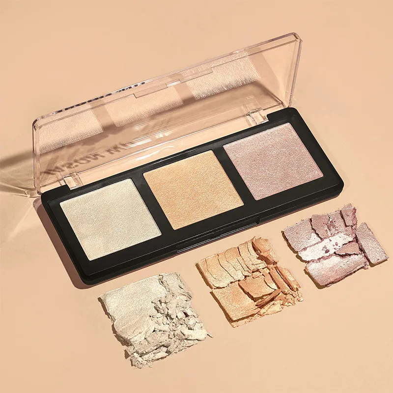 A highlighter palette with three shades and swatches on a peach background.