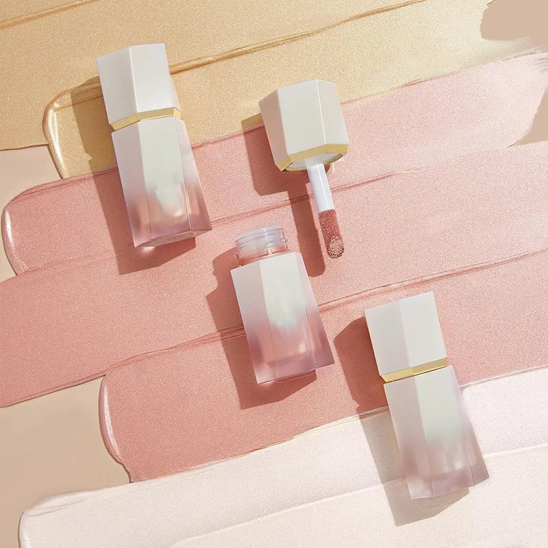Four tubes of lip gloss on a background of different colored swatches.
