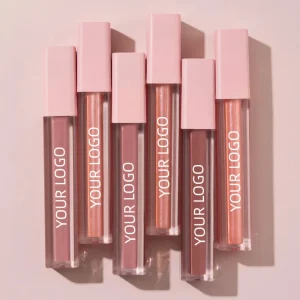 A collection of six lip glosses with pink caps and various shades.