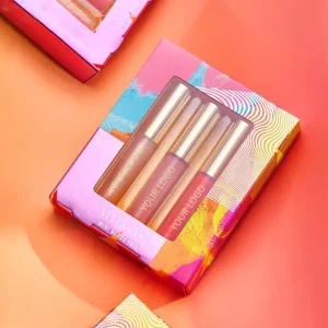 A colorful lip gloss packaging displaying three tubes of lip gloss with a customizable logo area.