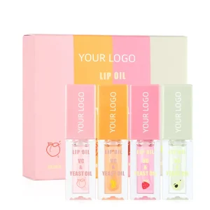A set of four lip oils with different flavors and colors in a branded packaging.