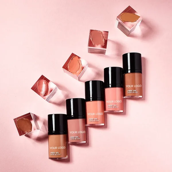 A collection of five liquid blush bottles with various shades on a pink background, accompanied by acrylic cubes with blush tints.