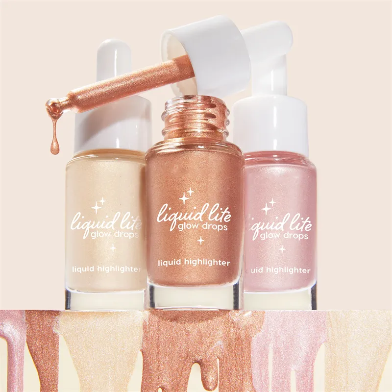Three bottles of Liquid Lite Glow Drops liquid highlighter with dripping applicator.