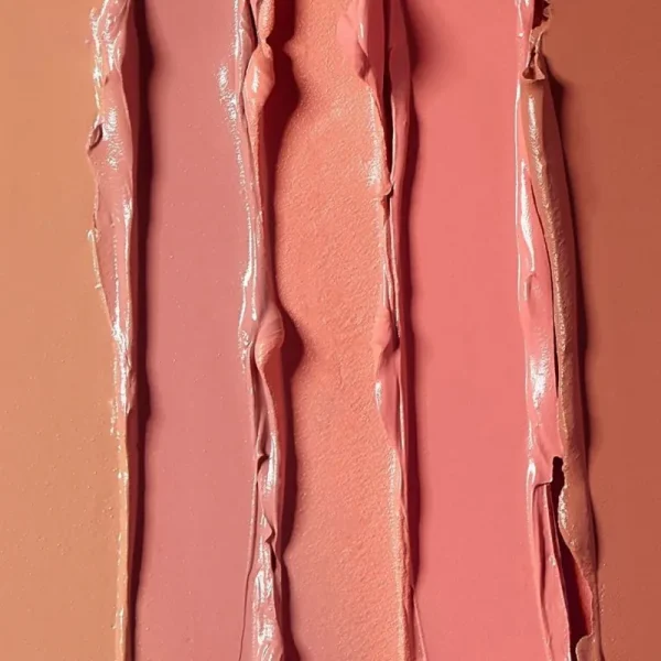 Various shades of makeup swatches in textured stripes.