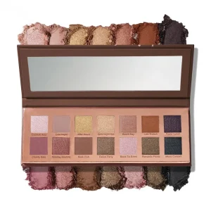 An open eyeshadow palette with twelve shades and a mirror, featuring names like Cocktail Hour, Date Night, After Hours, and Power Lunch.