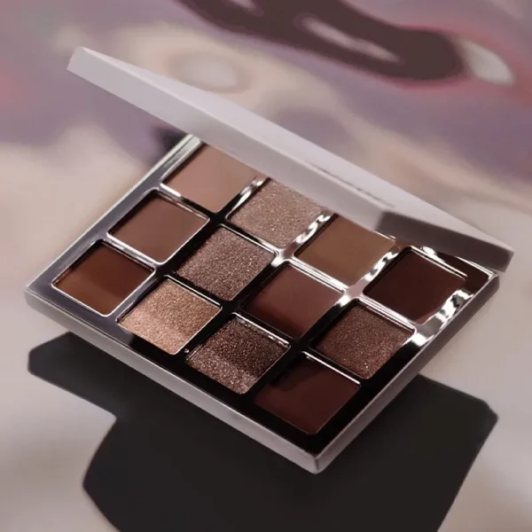 A 9-pan eyeshadow palette with a variety of brown and copper shades in matte and shimmer finishes.