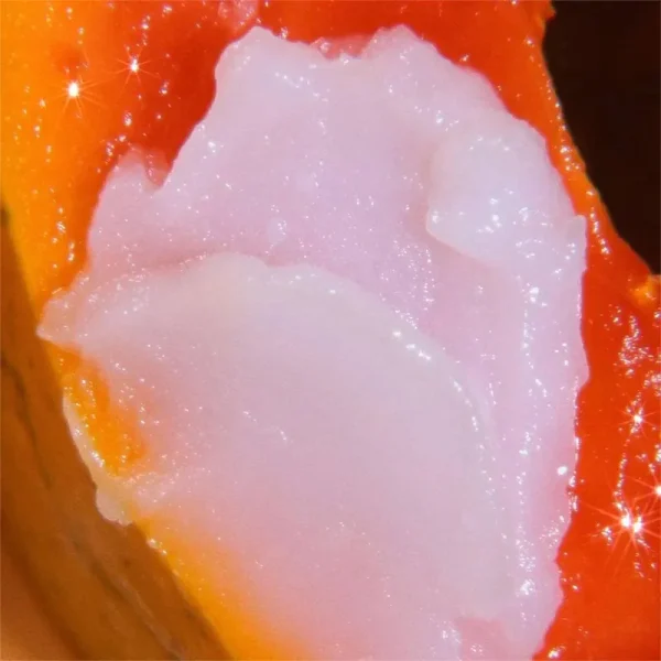 A close-up image showing the pink and glossy texture of pf-lewandowski's 'Polish Cow' food creation, resembling a cut of raw meat.