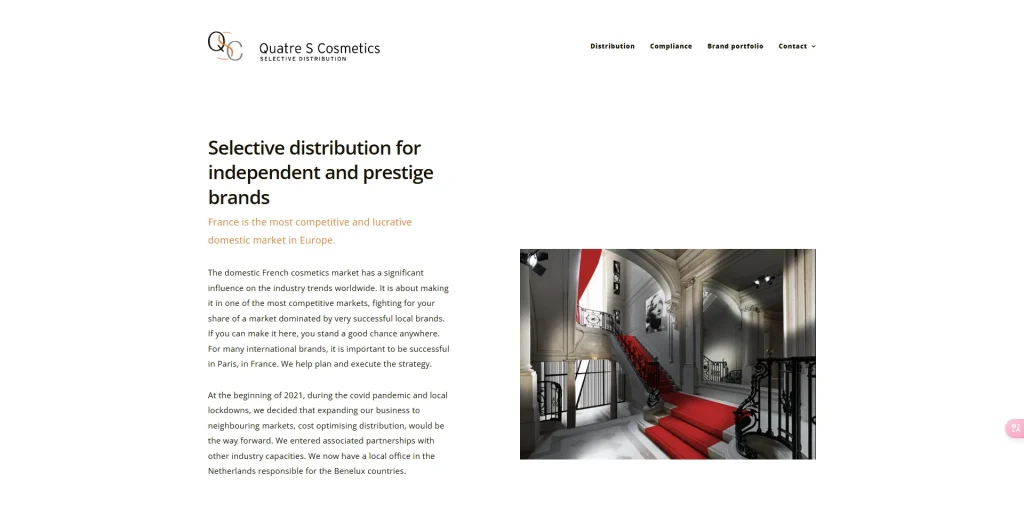 Quatre S Cosmetics webpage featuring a grand staircase with red carpet
