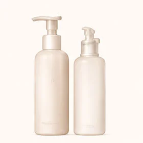 Two minimalist beige pump dispensing bottles, one tall and one smaller, placed on a light beige background.
