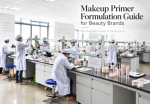 Scientists in a laboratory wearing lab coats and hair nets conducting makeup formulation research for beauty products.